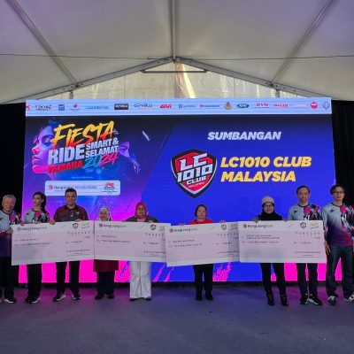 Cheque presentation on stage from LC1010 Club Malaysia to NGO