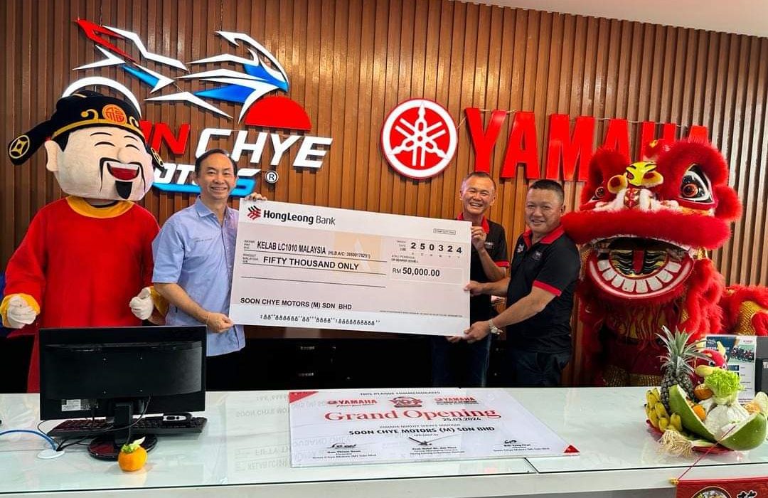 Cheque handover ceremony from Malaysia motorcycle dealer to LC1010 Club chairman