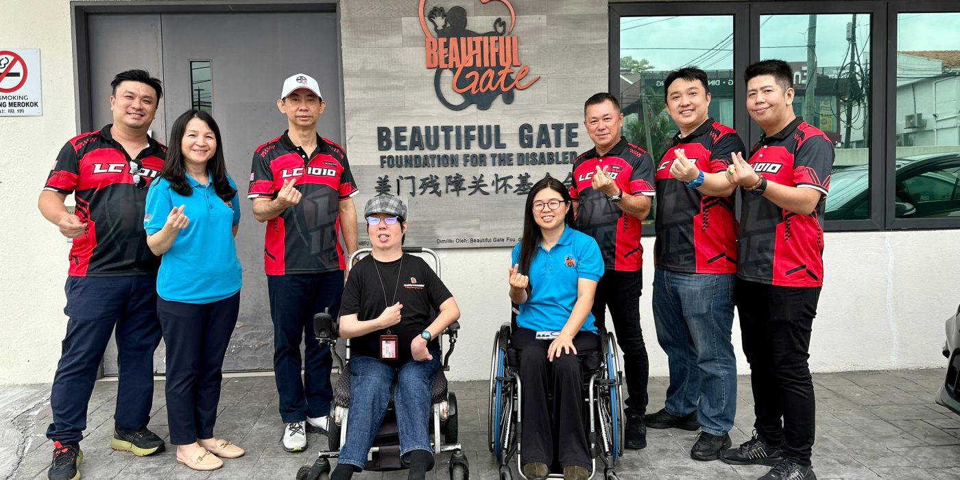 LC1010 Club representative handover assistive devices to charity organization.